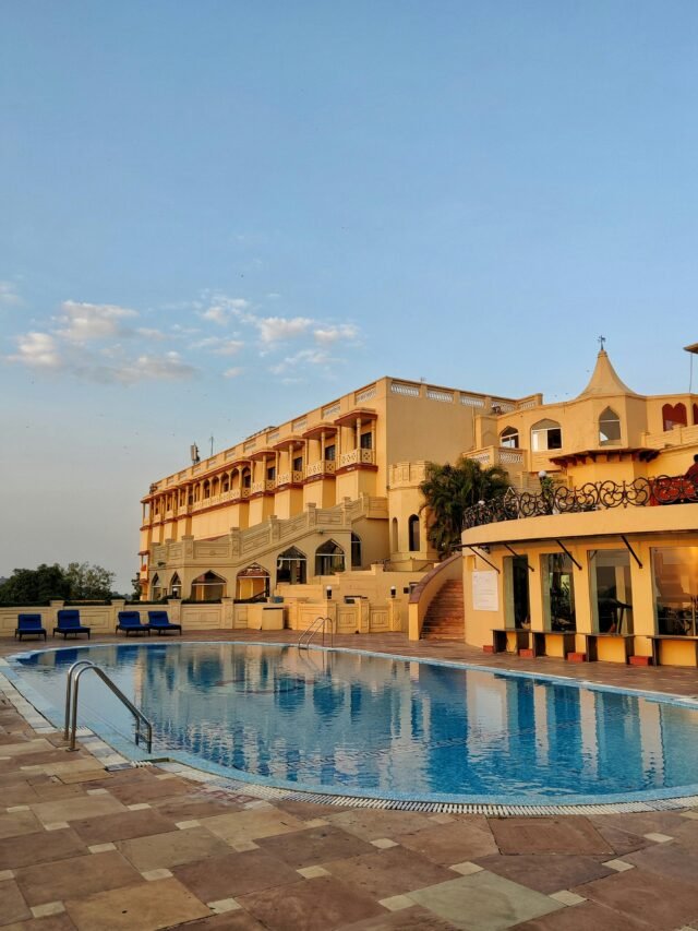 Elegant resort hotel in Bhopal, India, featuring a large swimming pool and luxury design.